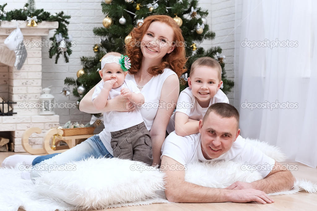 Family near Christmas tree