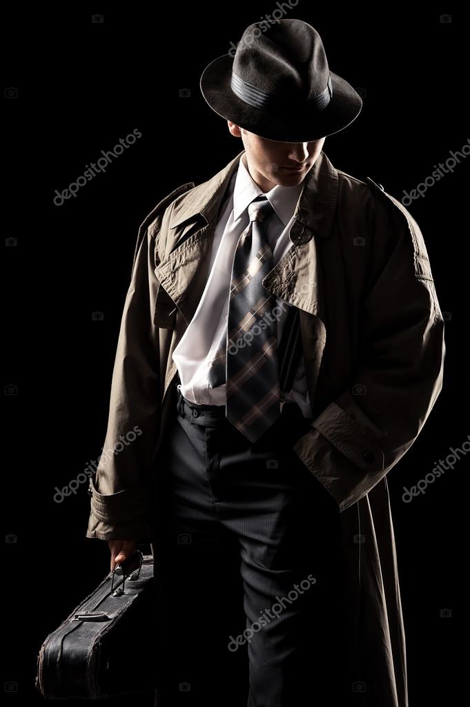 Young man in a raincoat — Stock Photo © idal #43972449