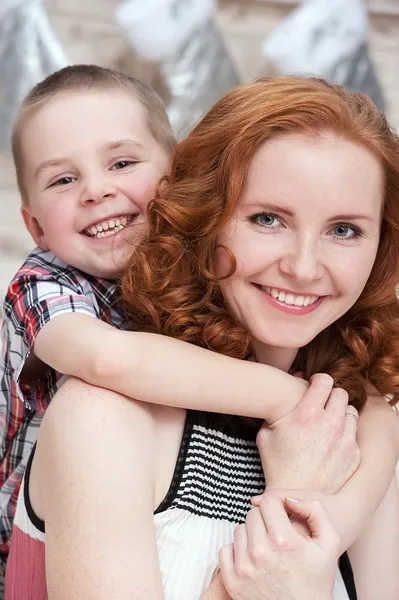 Mom and son at the Christmas tree — Stock Photo, Image