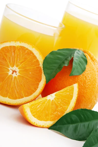 Orange juice and oranges — Stock Photo, Image