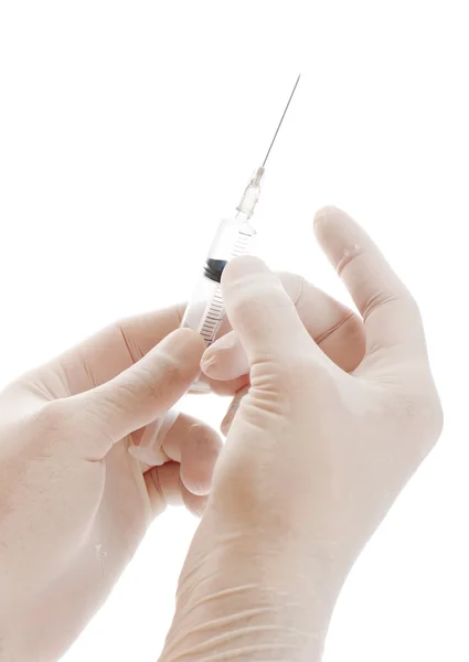 Syringe in handen — Stockfoto