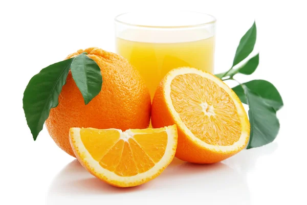 Orange juice and oranges — Stock Photo, Image