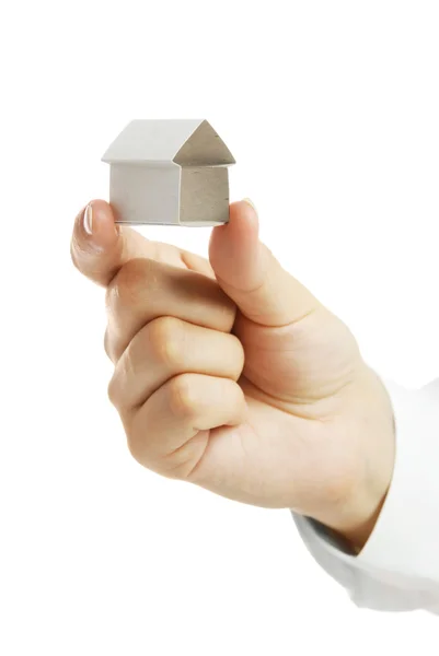Small house from a paper in a hand — Stock Photo, Image