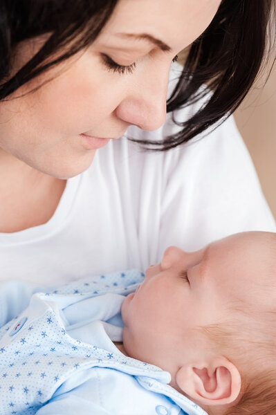 Mother kissing son