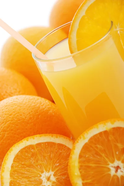 Orange juice and oranges — Stock Photo, Image