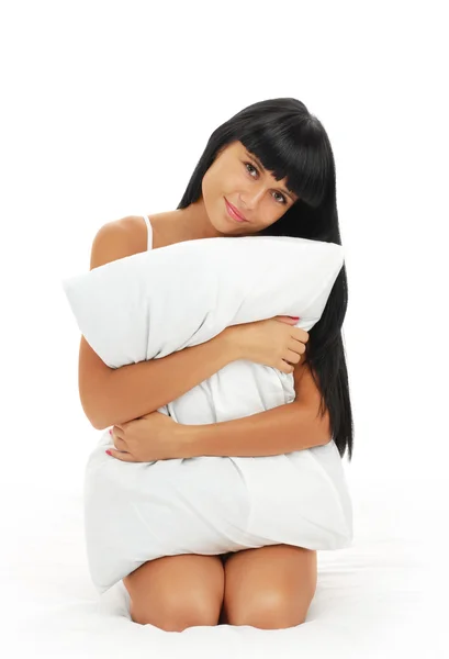 Girl  embraces a pillow — Stock Photo, Image