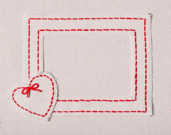 Embroidered frame with heart — Stock Photo, Image