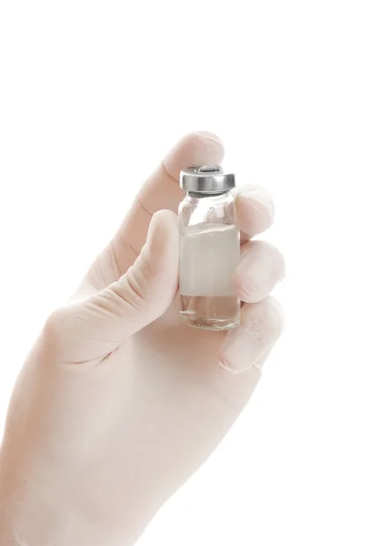 Vial with a medicine in a hand — Stock Photo, Image