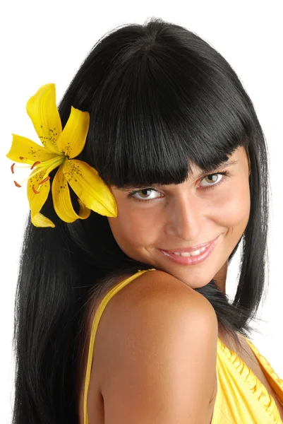 Girl with a flower in hair — Stock Photo, Image