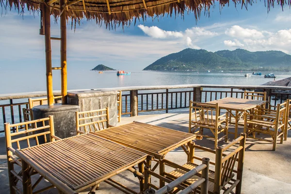 Wooden table in sea seaside restuarant — Stock Photo, Image