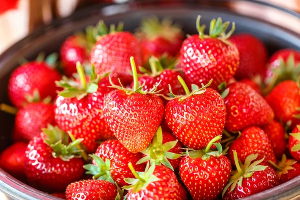 Red juicy fresh strawberries closeup in a basket — Stock Photo, Image