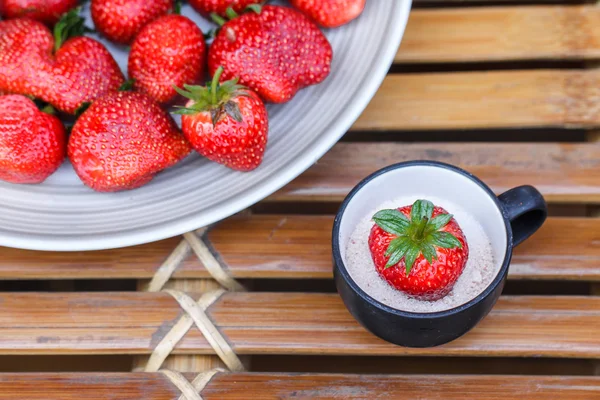 Strawberry in a cup of dessert on bamboo table — Stock Photo, Image