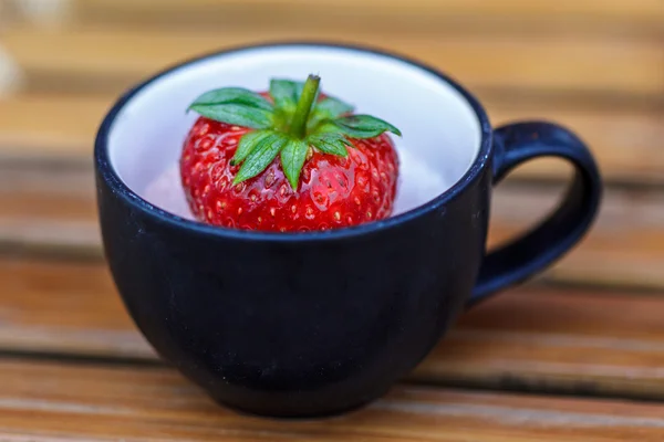 Strawberry in a cup of dessert on bamboo table — Stock Photo, Image