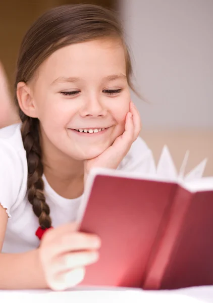 Little girl is reading a book — Stock Photo, Image