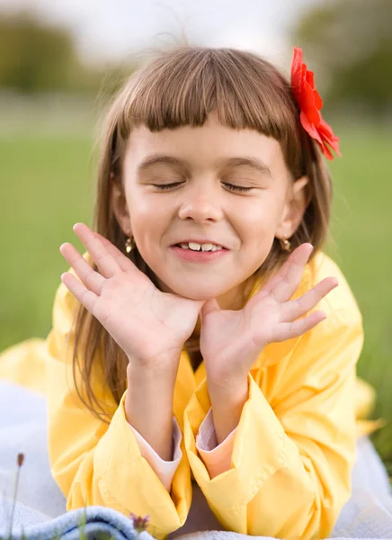 Little girl is daydreaming — Stock Photo, Image