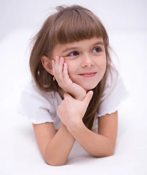 Little girl is daydreaming — Stock Photo, Image