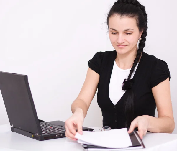 Young woman is playing on laptop — Stock Photo, Image