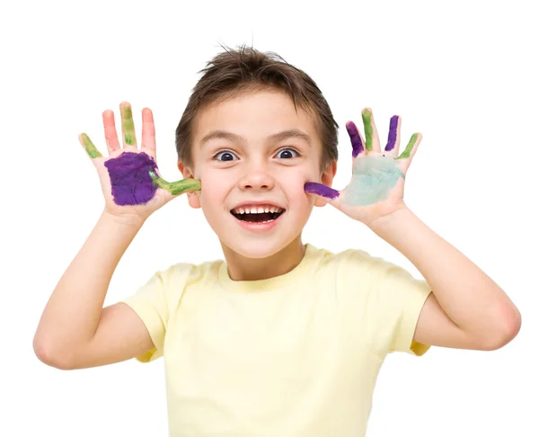 Portrait of a cute boy playing with paints — Stock Photo, Image