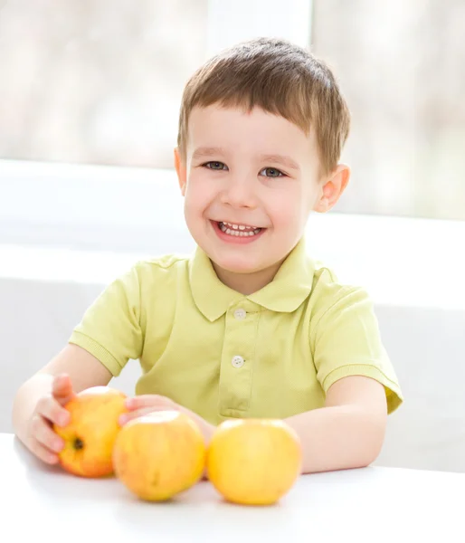 Portrait of a happy little boy with apples — Stock Photo, Image