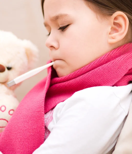 Little girl with thermometer in her mouth — Stock Photo, Image