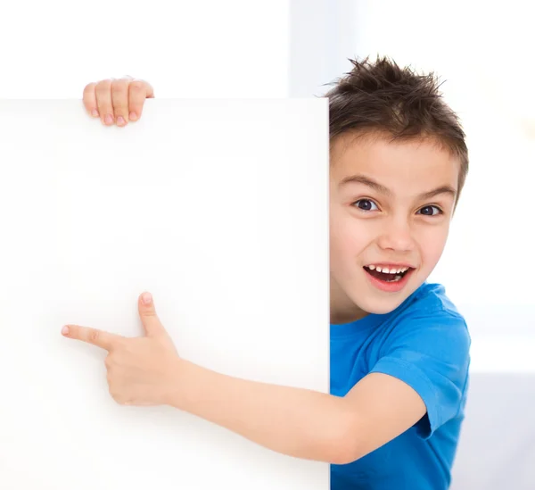 Cute boy is holding blank banner Stock Picture