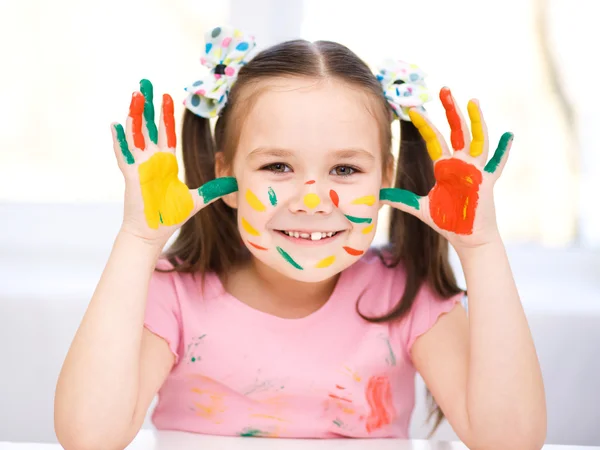 Portrait of a cute girl playing with paints — Stock Photo, Image