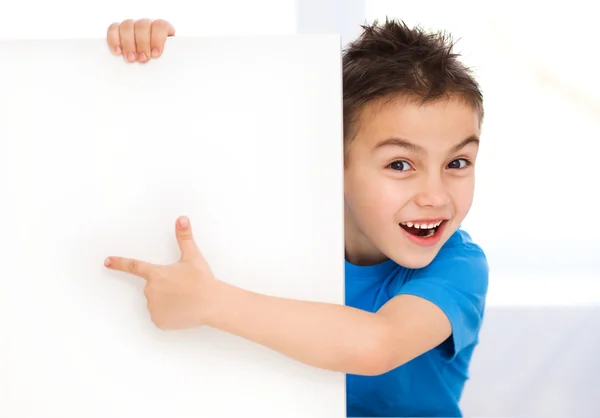 Cute boy is holding blank banner Stock Photo