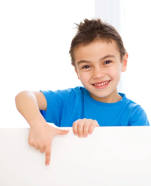 Cute boy is holding blank banner Stock Image