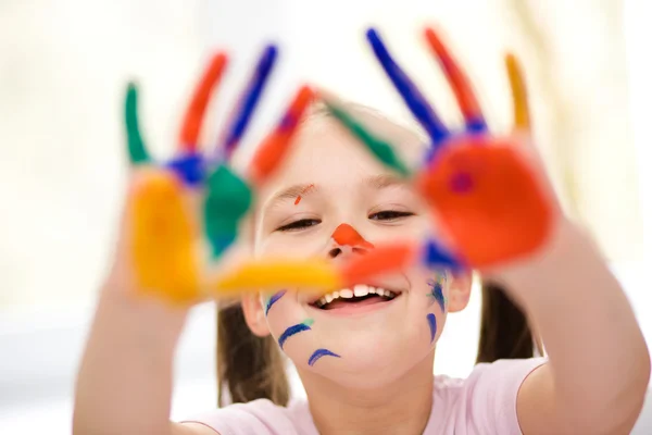 Portrait of a cute girl playing with paints — Stock Photo, Image