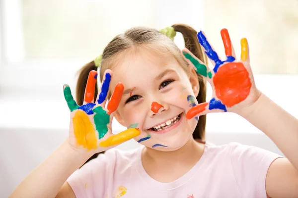 Portrait of a cute girl playing with paints — Stock Photo, Image