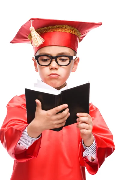 Schattige jongen houdt boek — Stockfoto