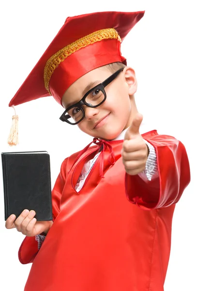 Cute boy is holding book — Stock Photo, Image