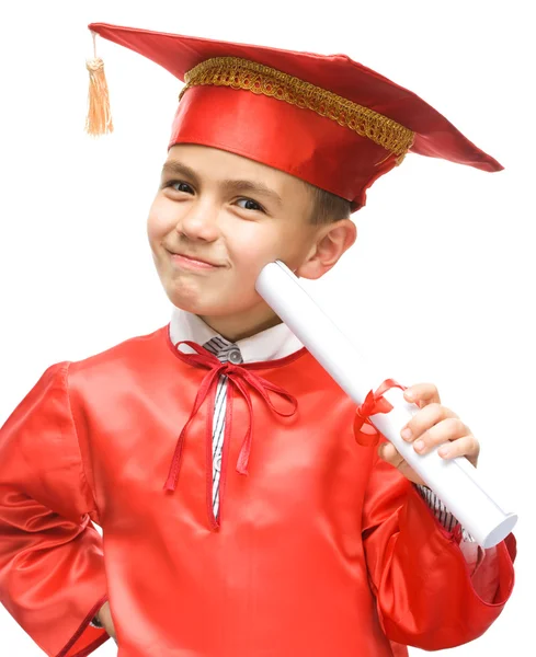 Cute boy is holding book — Stock Photo, Image