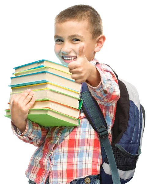 Lindo chico está sosteniendo libro —  Fotos de Stock