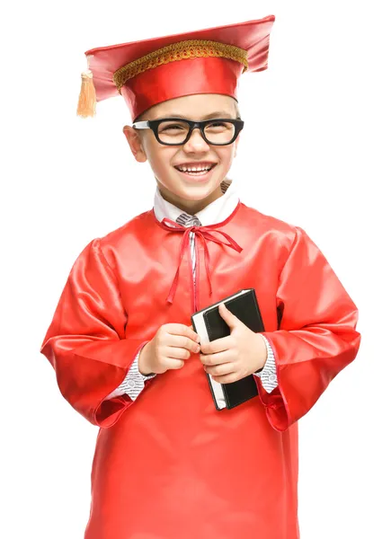 Cute boy is holding book — Stock Photo, Image