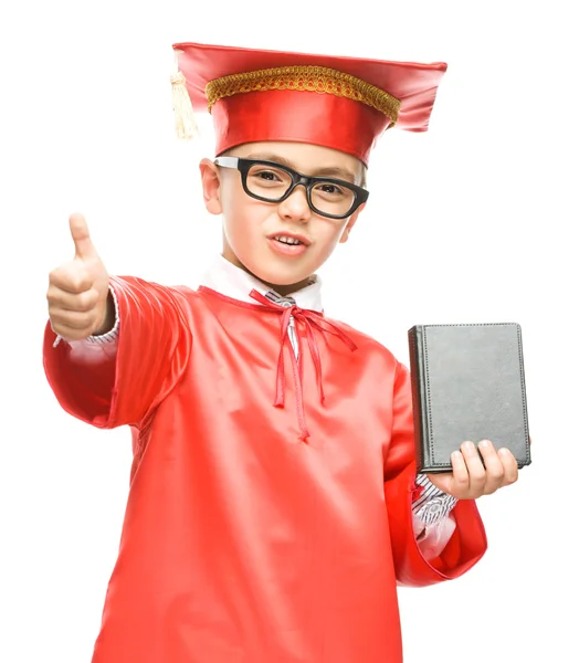 Cute boy is holding book — Stock Photo, Image