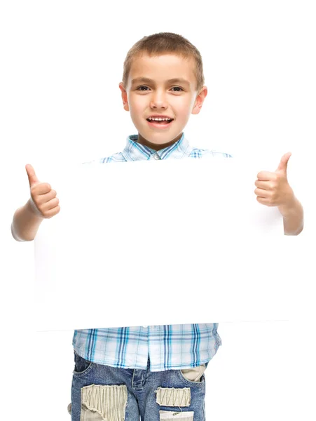 Cute boy is holding blank banner — Stock Photo, Image