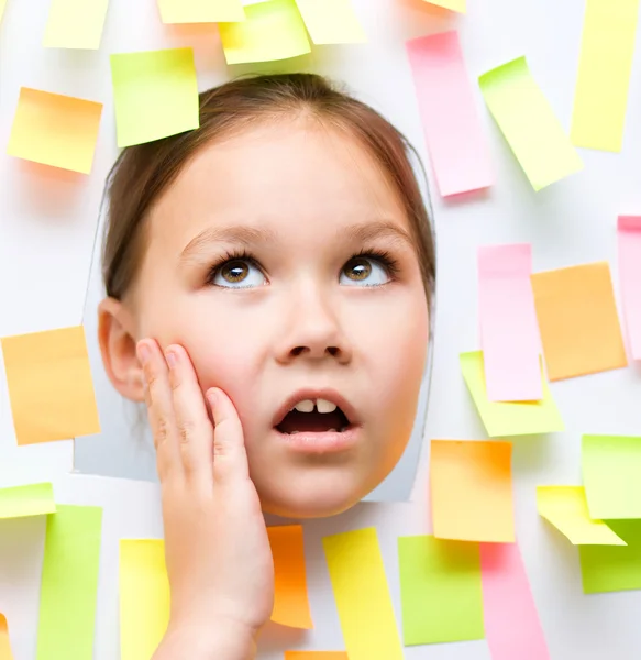 Cute girl with lots of reminder notes — Stock Photo, Image