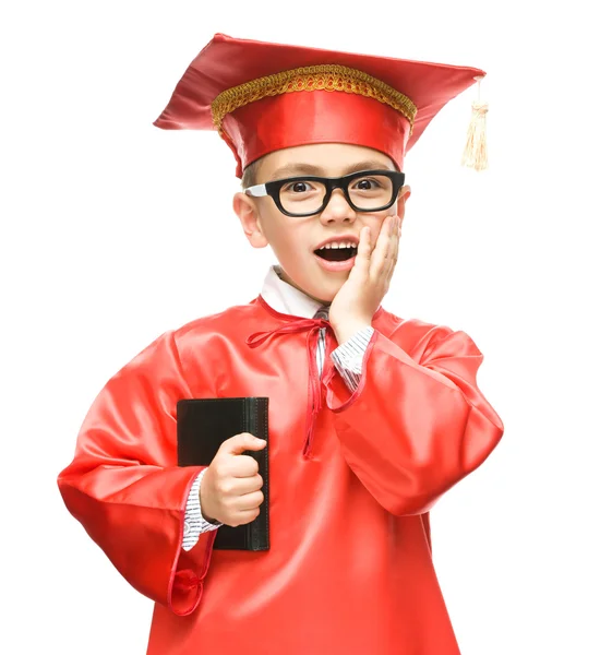 Cute boy is holding book — Stock Photo, Image