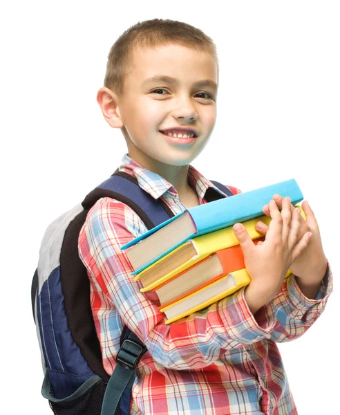Ładny chłopiec trzyma książki — Zdjęcie stockowe
