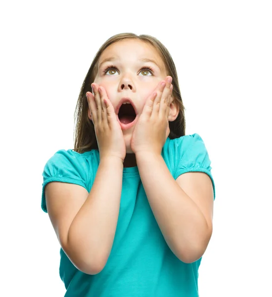 Cute girl is holding her face in astonishment — Stock Photo, Image