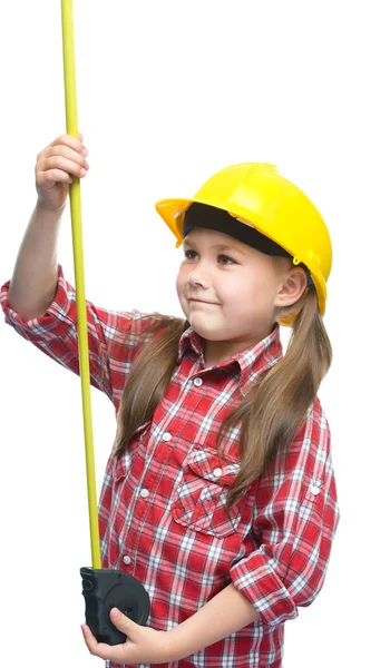 Girl as a construction worker with tape measure — Stock Photo, Image