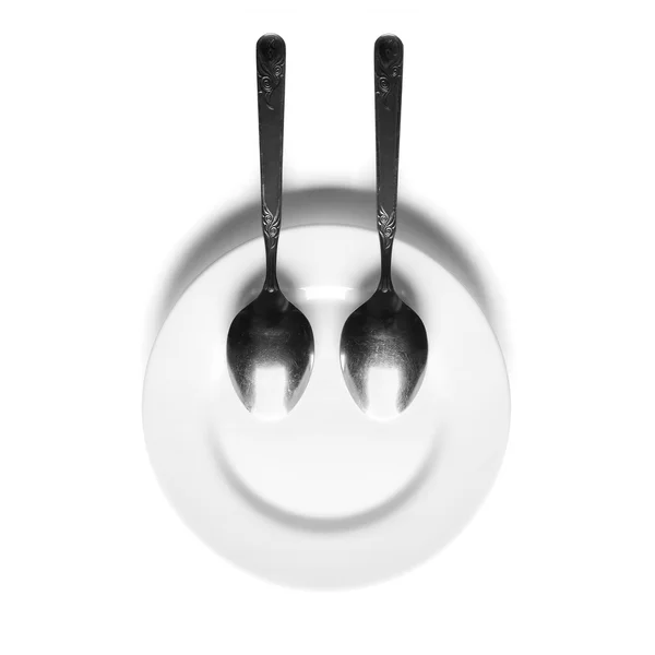 Close up of a silver spoon and fork on a white background — Stock Photo, Image