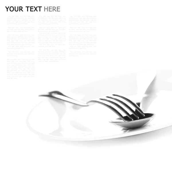Close up of a silver spoon and fork on a white background (with — Stock Photo, Image