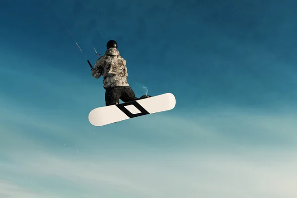 Navegando en una tabla de snowboard en un lago congelado — 스톡 사진