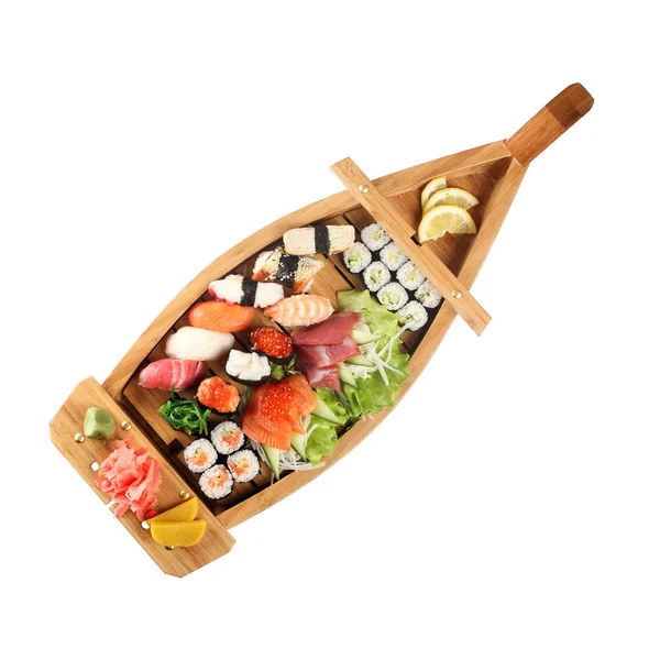 在船上孤立的形式的木架子上的寿司一套 — 图库照片