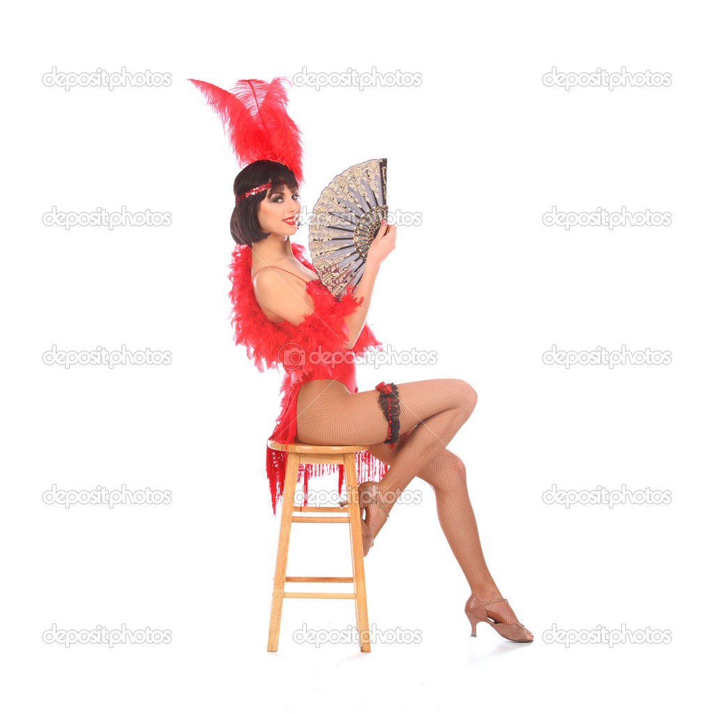 Burlesque dancer with red plumage and short dress, isolated on white