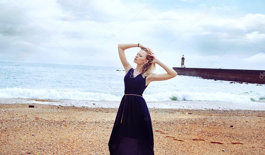 Summer photo of blonde girl on beach.
