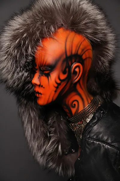 Painted mannequin Girl in furs and leather jacket