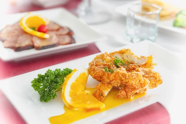 Fried chicken with sauce lemon  on a plate — Stock Photo, Image